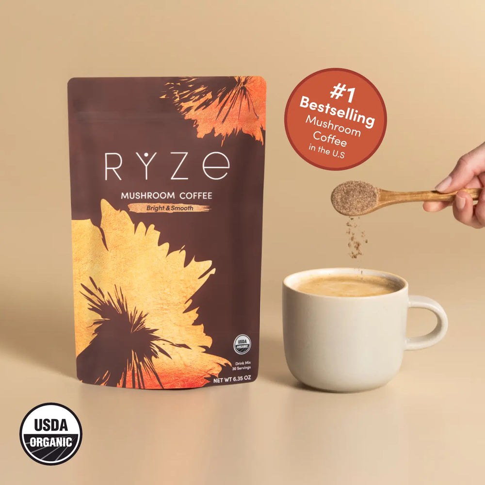 RYZE Medium Roast mushroom coffee pouch beside a prepared mug
